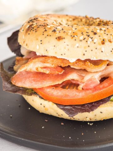 close up of a blt on an everything bagel