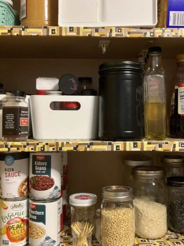 three shelves of a variety of pantry ingredients.